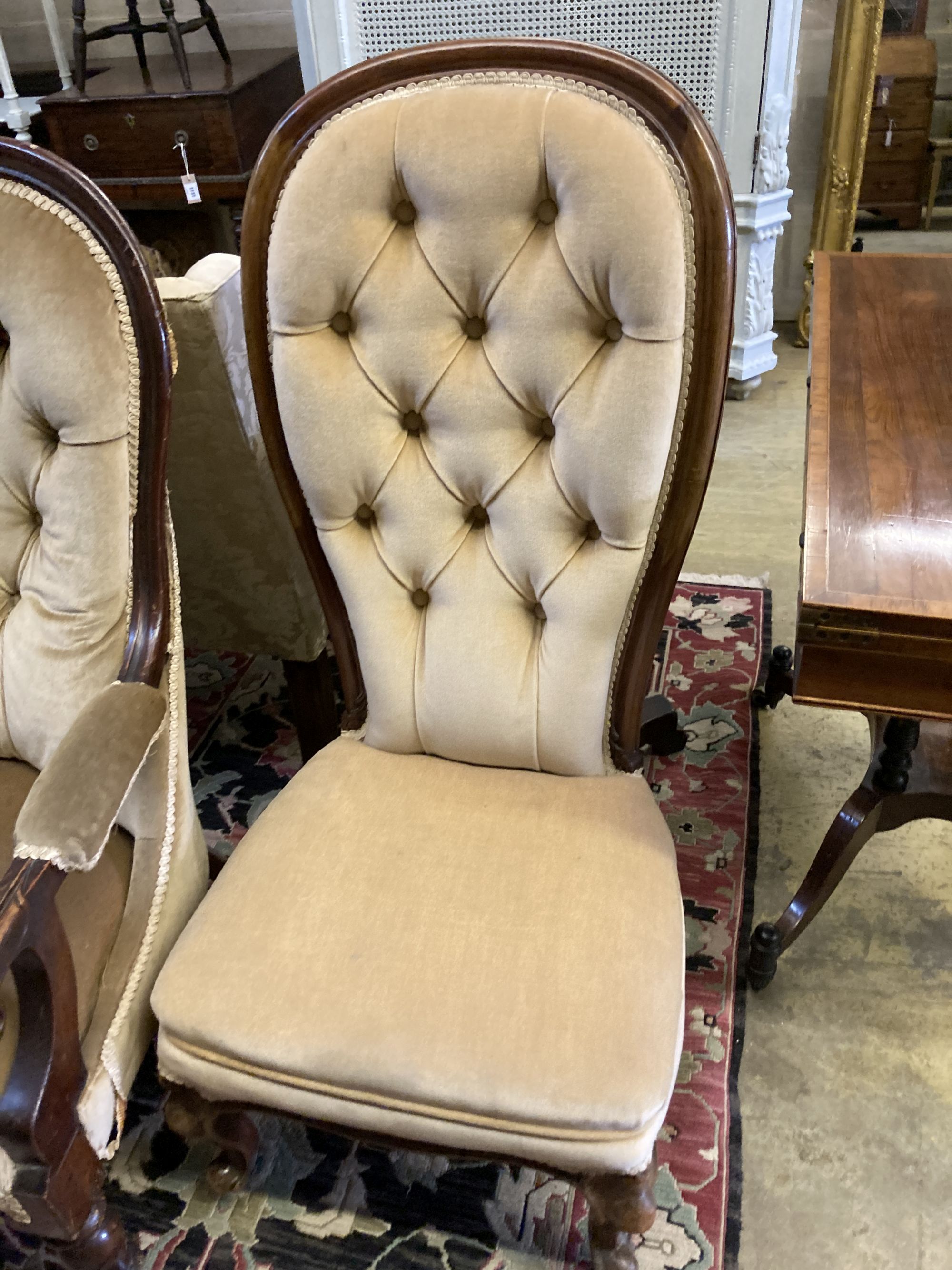 Two Victorian mahogany spoonback chairs (one with arms)